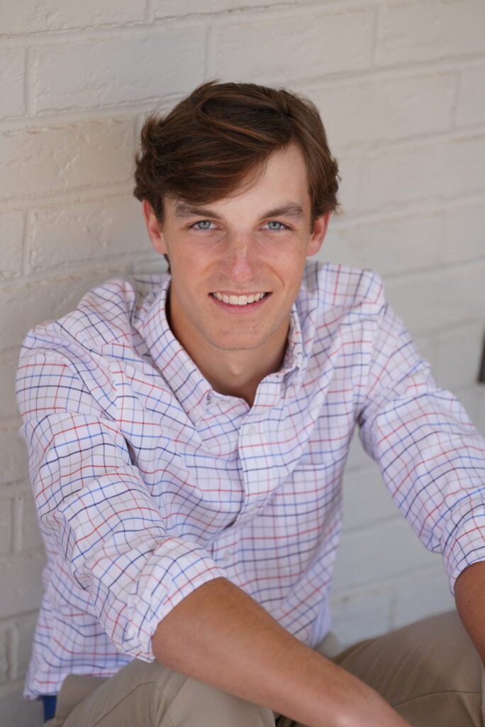 Senior portrait of a boy with checked button-down shirt